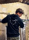 Back of the black Shuette hoodie with owl emblem