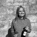 Portrait holding a Sinta bottle and a glass of wine
